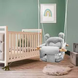 Columpio de bebé gris instalado en una habitación infantil junto a la cuna