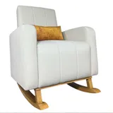 Mecedora vanguardista blanca con cojín lumbar dorado y balancines de madera